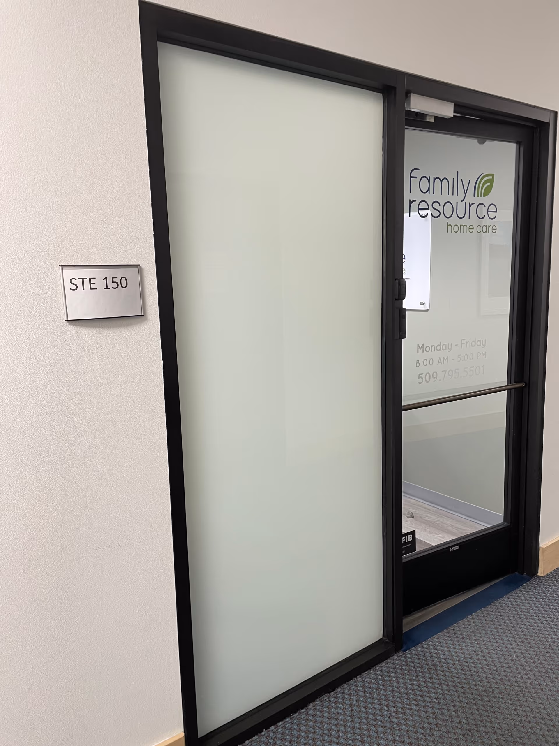 Frosted glass door with Family Resource Home Care signage in a hallway