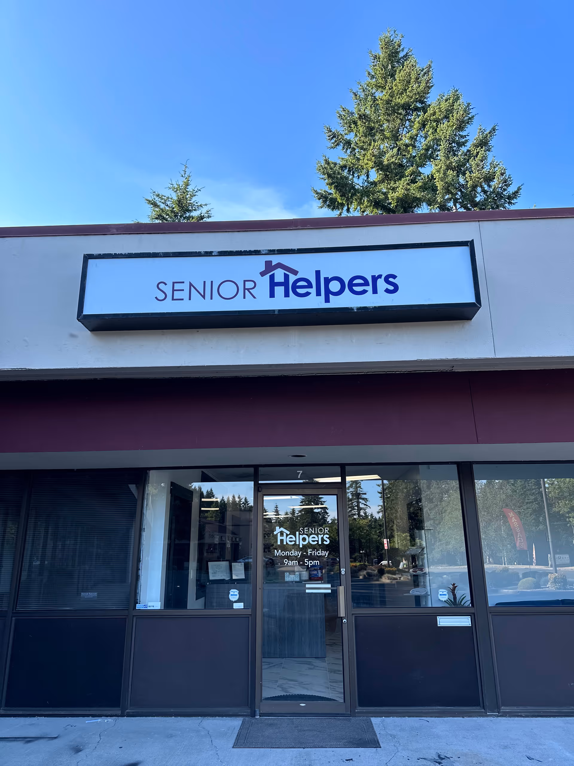 Exterior view of Senior Helpers facility entrance with sign.
