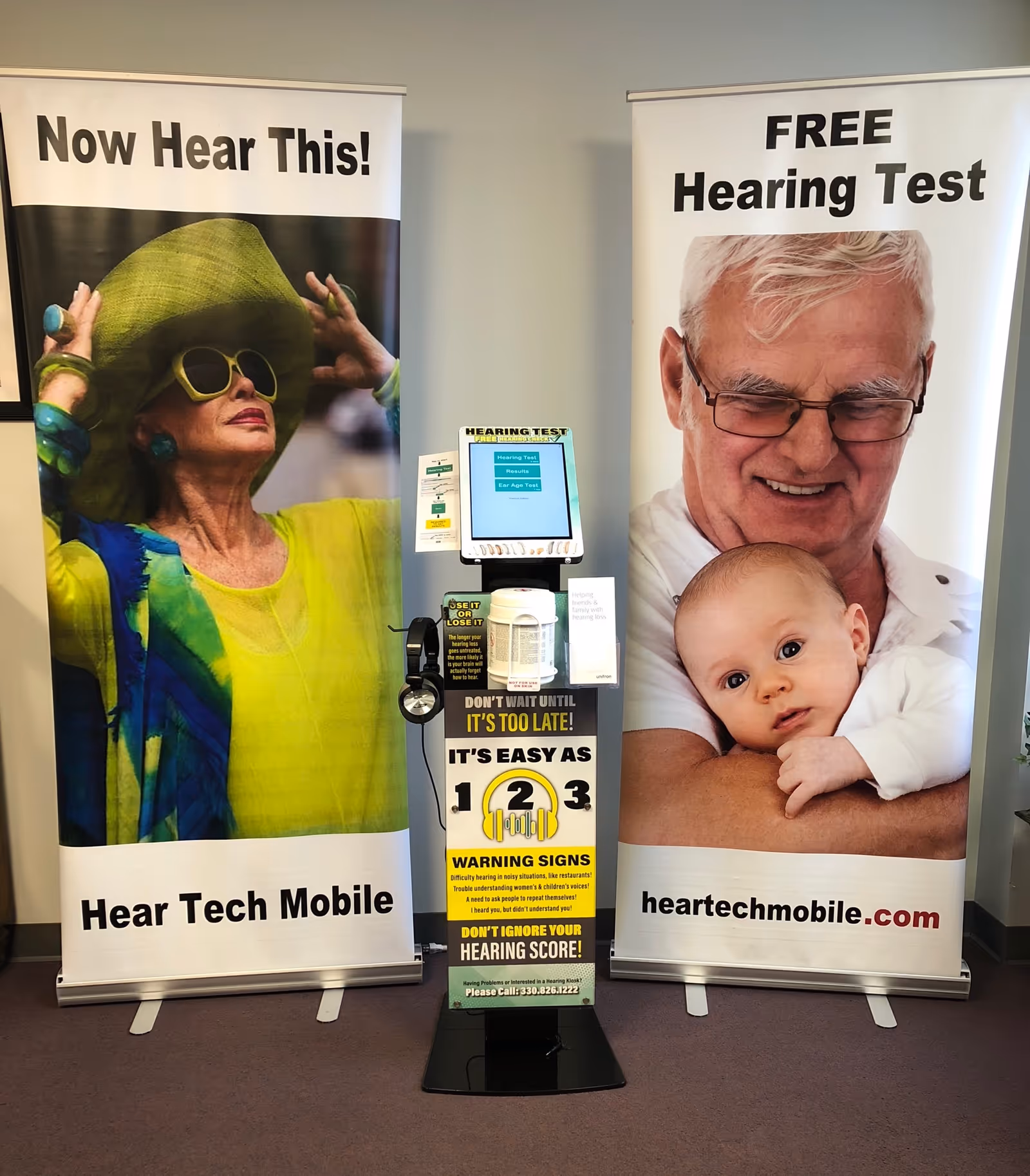 Display for Hear Tech Mobile & Hearing Care Center with banners and a hearing test kiosk.