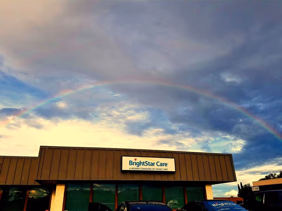 Front exterior of BrightStar Care building with a rainbow overhead.