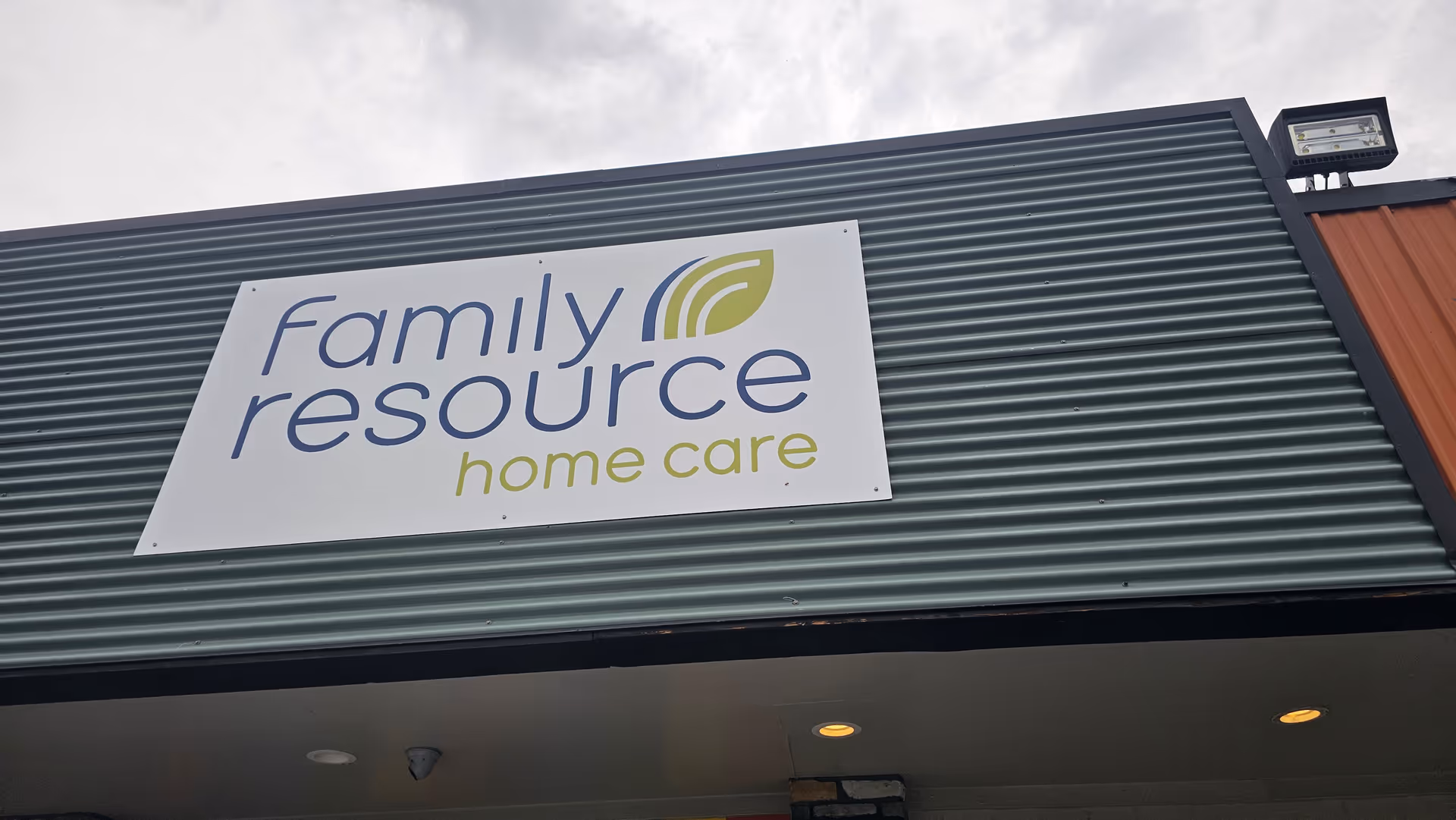 Exterior view of a building with a large Family Resource Home Care sign.
