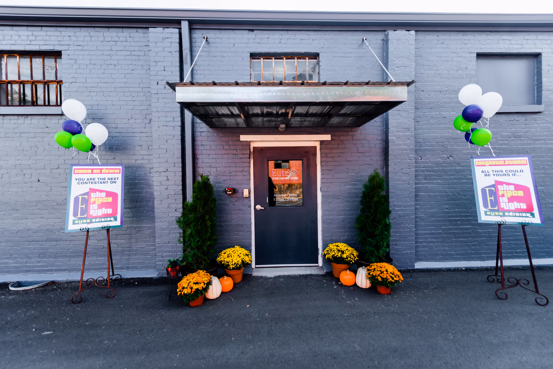 Exterior view of Elite Home Care entrance with balloons and autumn decorations