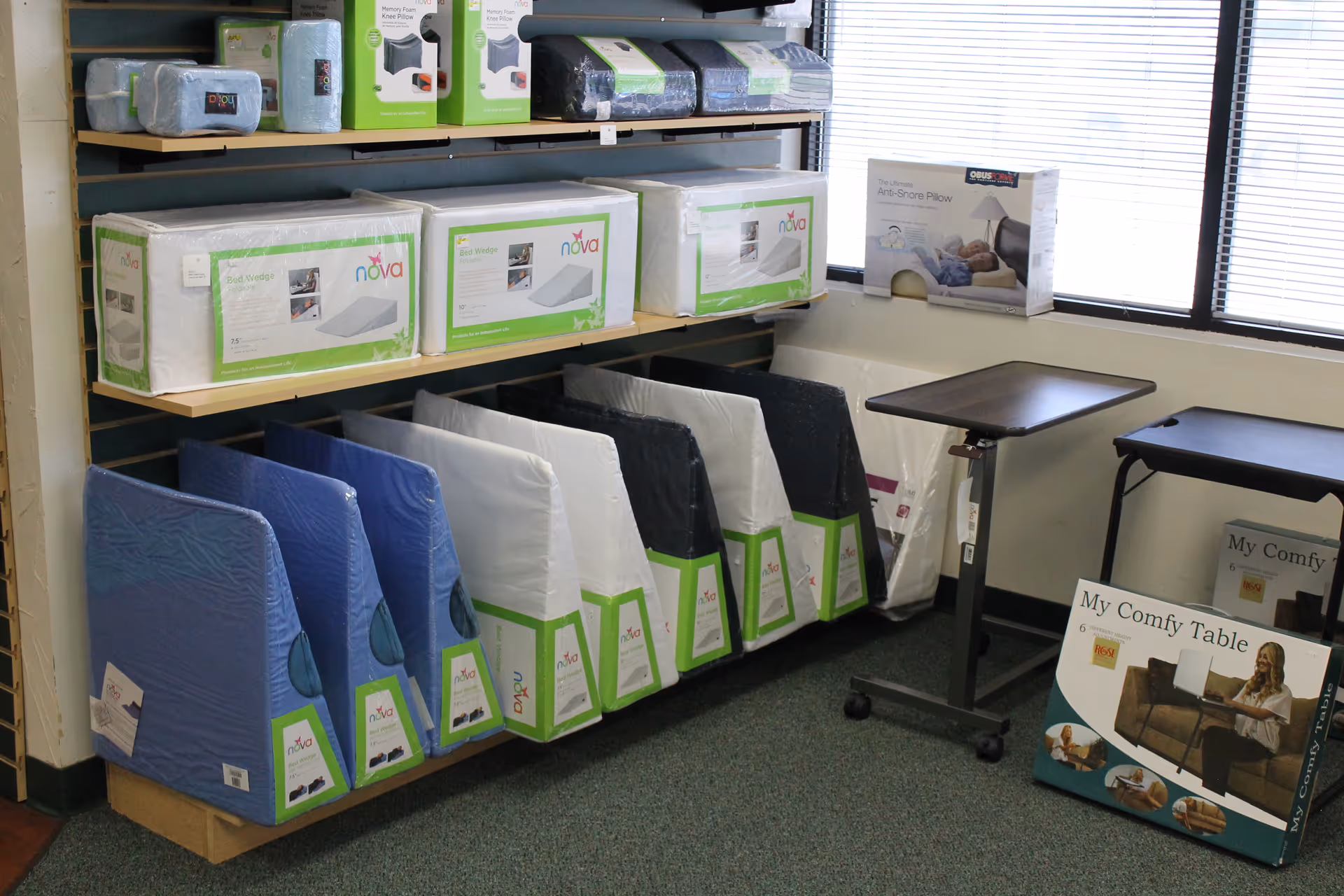 Shelves stocked with medical supplies and patient care products in a facility storage room.