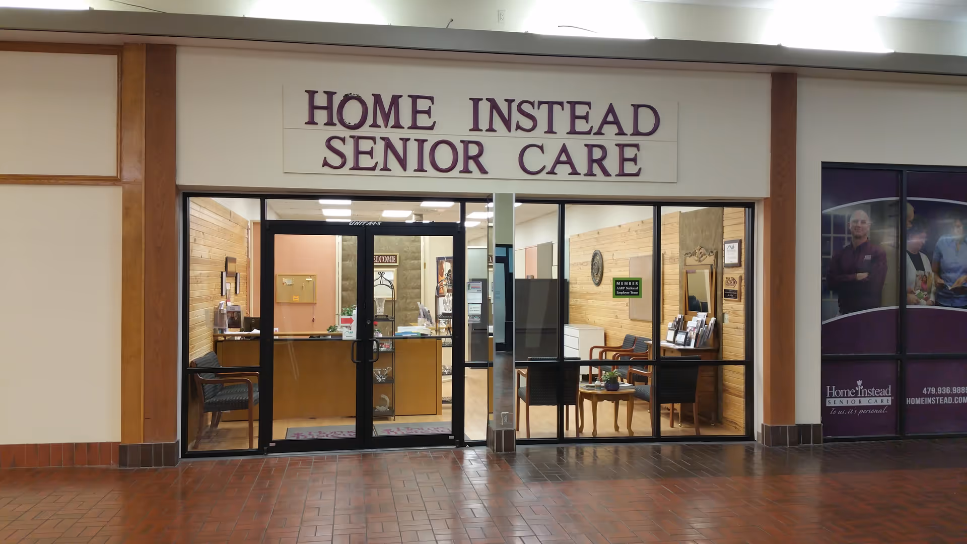 Home Instead Senior Care storefront with glass doors and reception area visible inside.