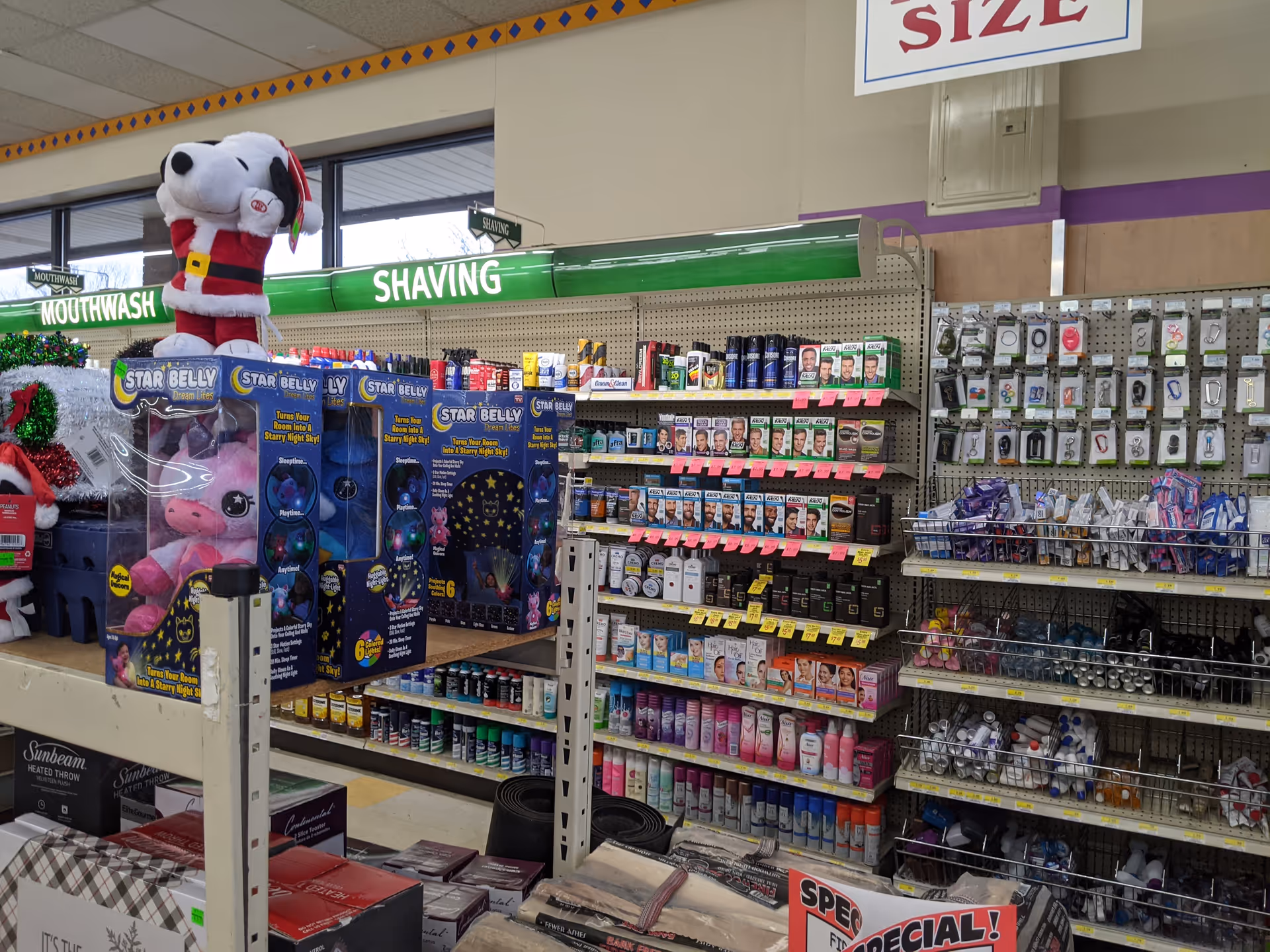 Inside Discount Drug Mart, shelves display shaving products, mouthwash, and assorted merchandise.