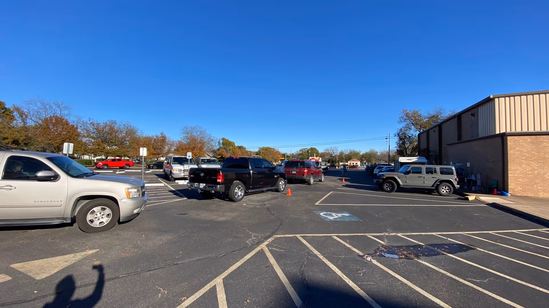 Bright, clear day over a parking lot beside a senior care facility exterior