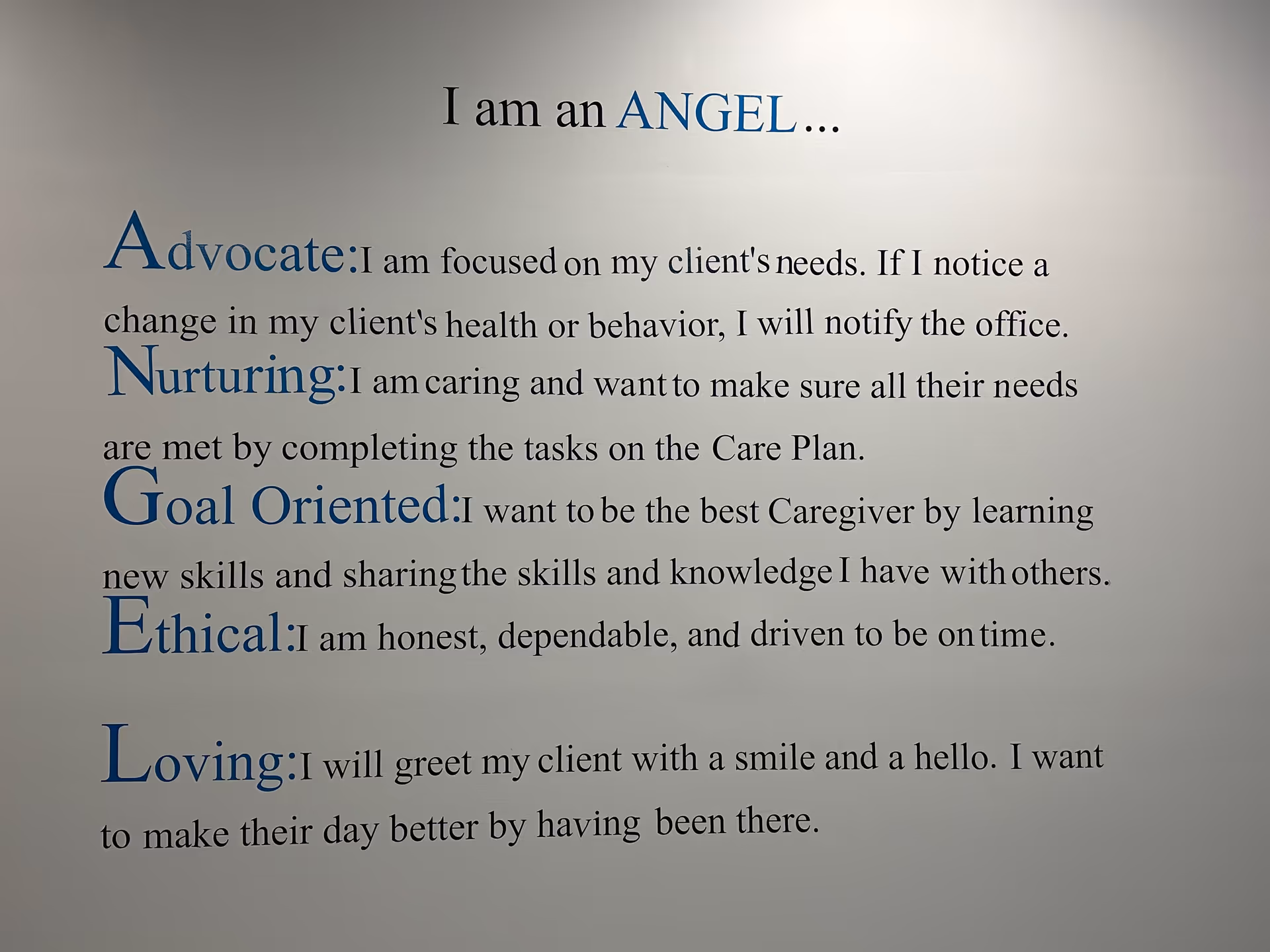 Interior wall displays inspirational text about being an ANGEL in blue lettering.