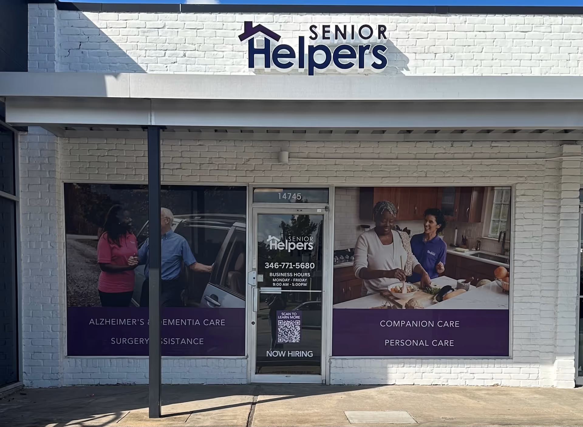 Senior Helpers storefront with large window posters featuring caregivers and seniors.