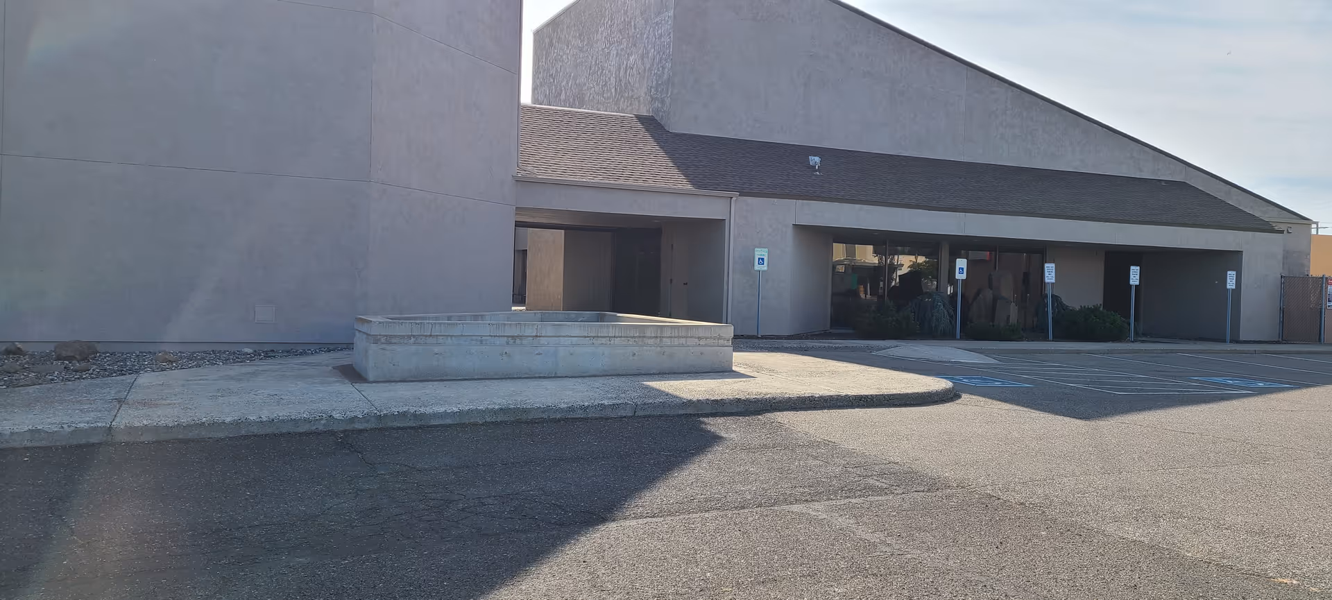 Exterior view of Visiting Angels Senior Home Care building with a parking area.