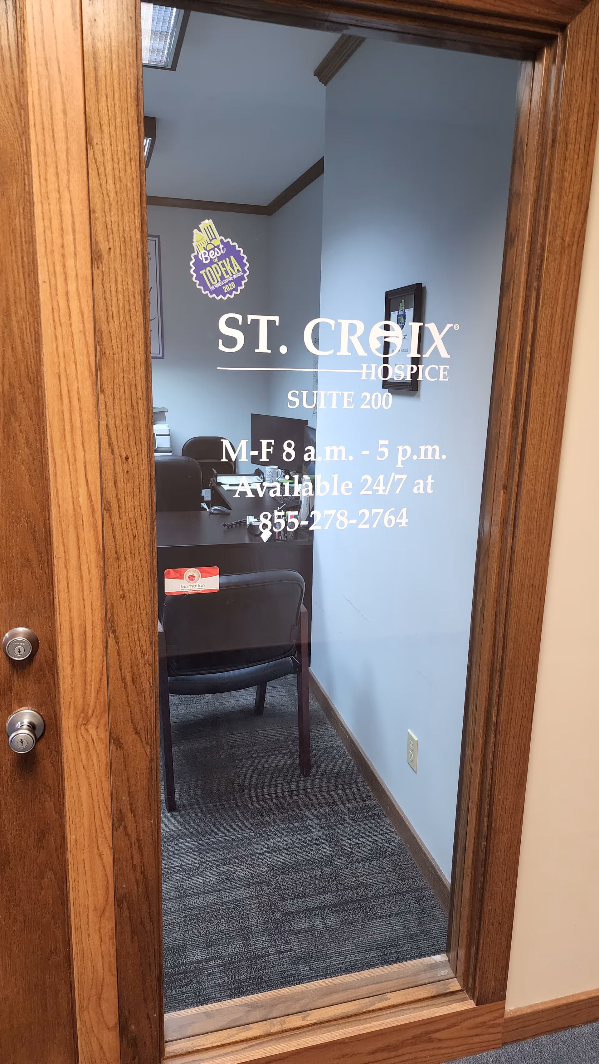 Glass-panel door reveals a small waiting area inside St. Croix Hospice.