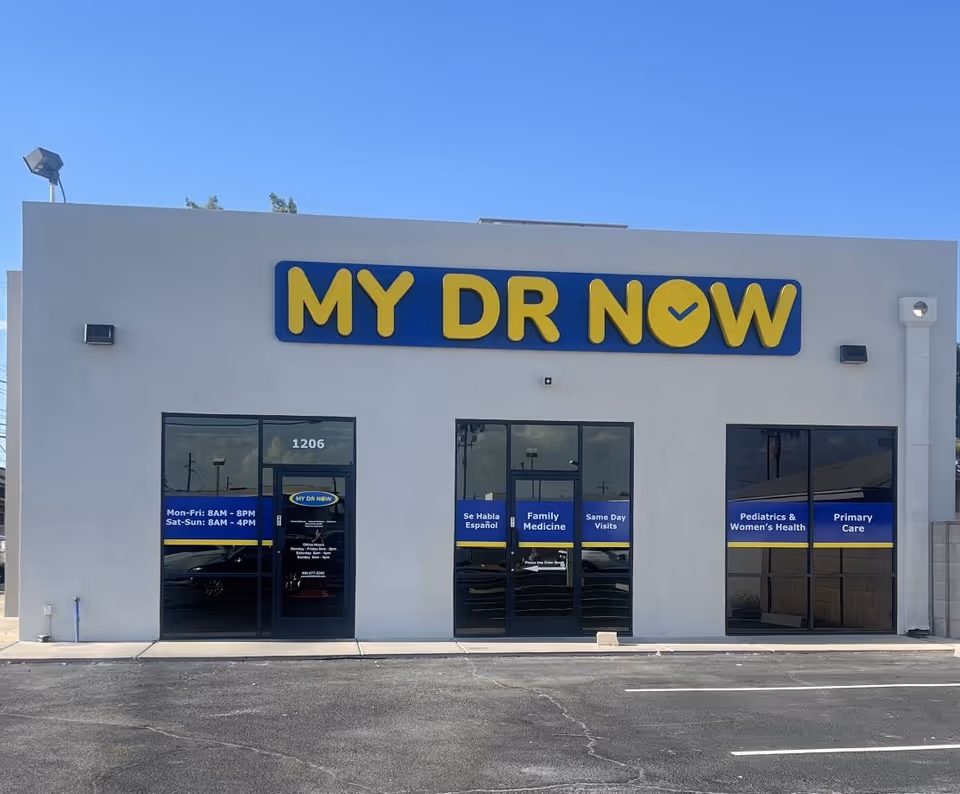 White building exterior with a large MY DR NOW sign above glass doors.