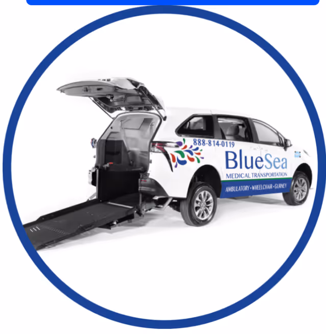 White BlueSea medical transport van with wheelchair lift, parked outdoors.