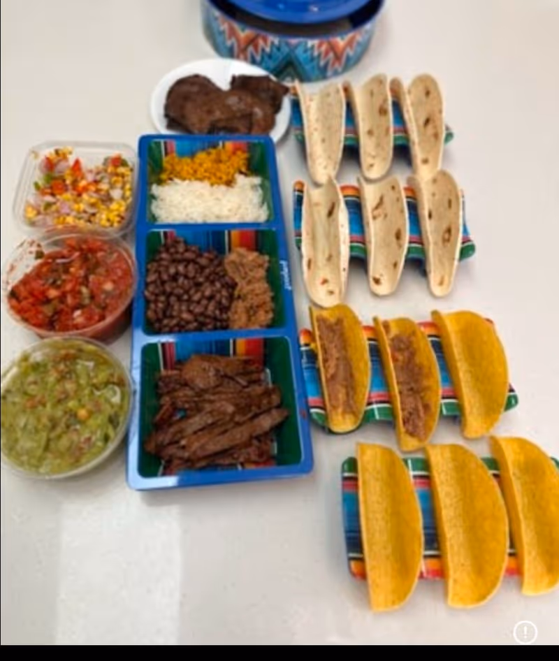 Assorted meals with beans, rice, salad, and tortillas arranged on colorful dining trays.