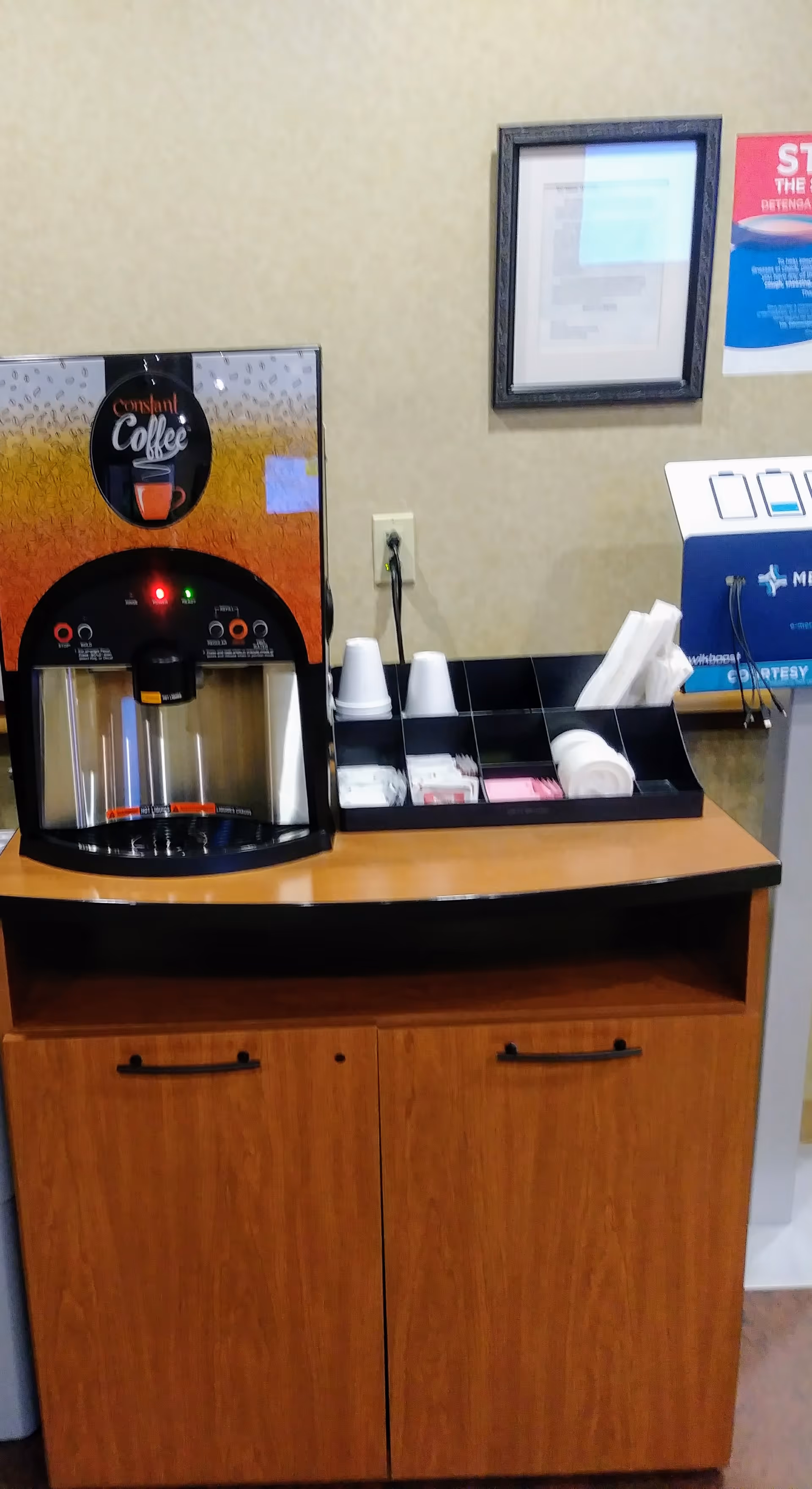 Coffee station in Mercy Health Clermont Hospital break area with cups and napkins.