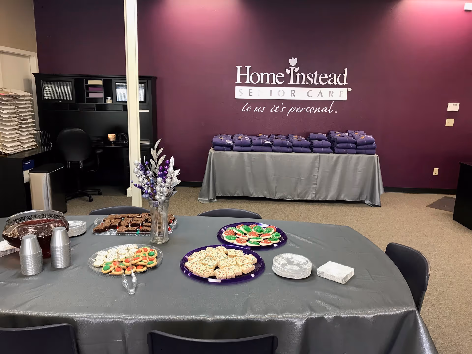 Interior of Home Instead senior care room with a snack table and purple wall.