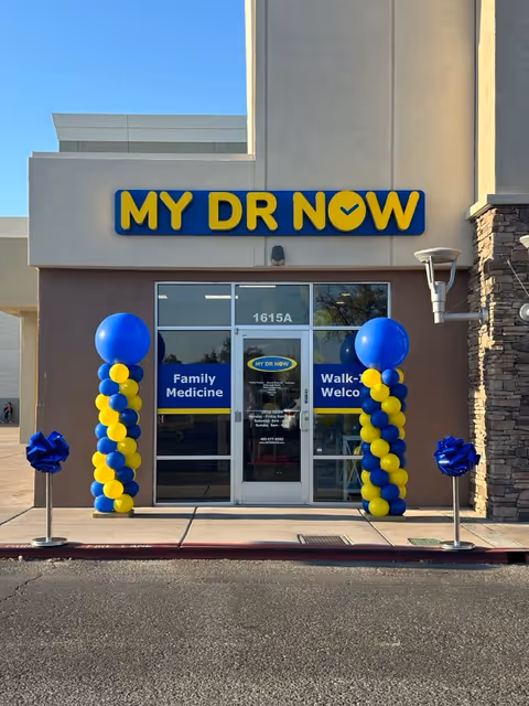 Front entrance of MY DR NOW facility with blue and yellow balloon columns.