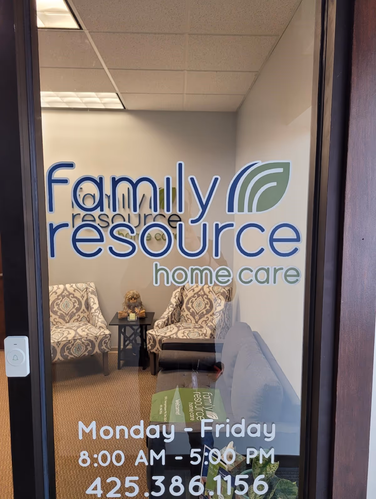 Glass door with Family Resource Home Care logo reveals a waiting area.