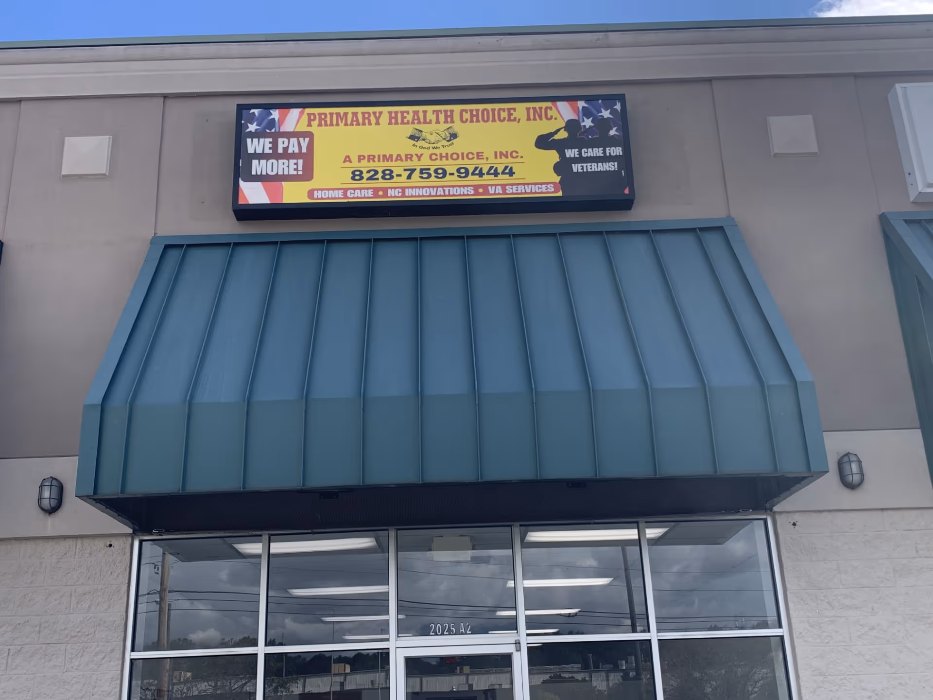 Front of a building with a teal awning and a sign reading Primary Health Choice, Inc.