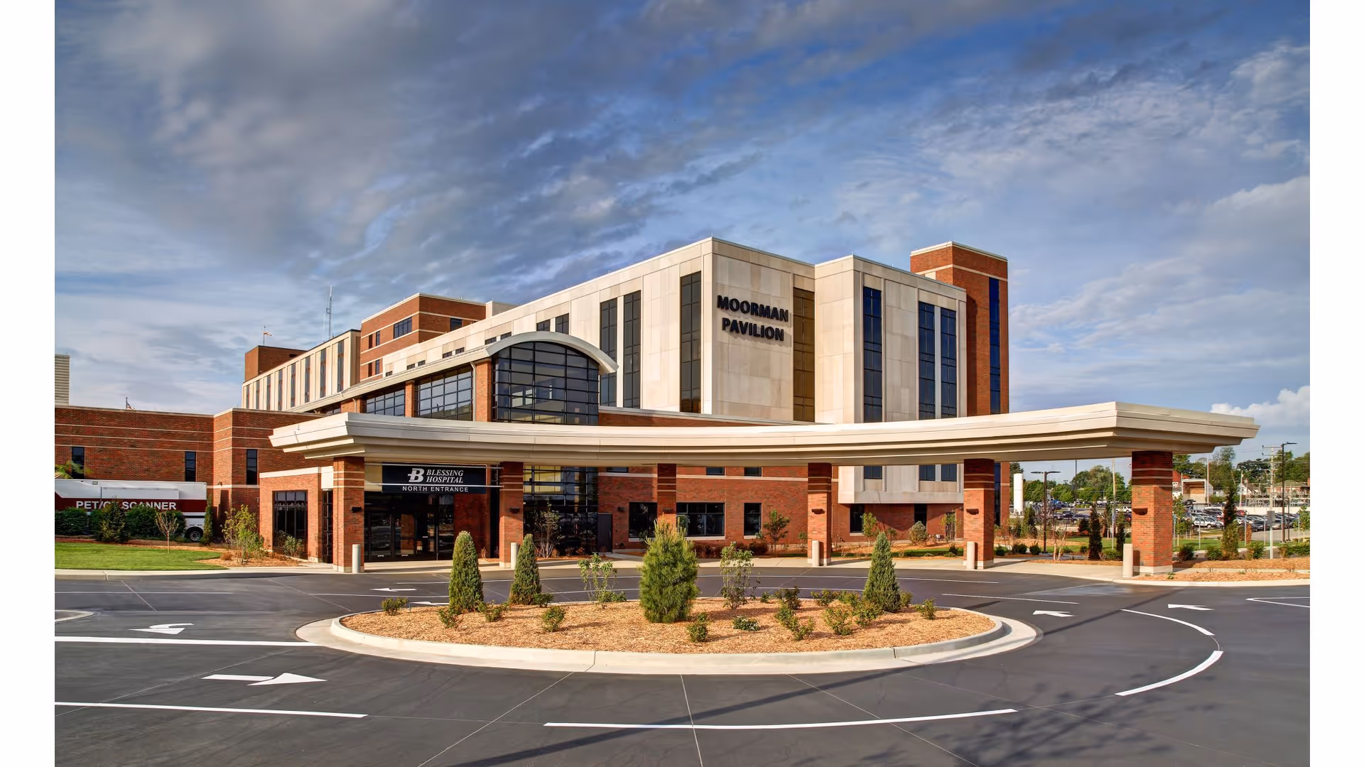 Blessing Hospital exterior with curved entrance canopy, brick facade, and circular front drive.