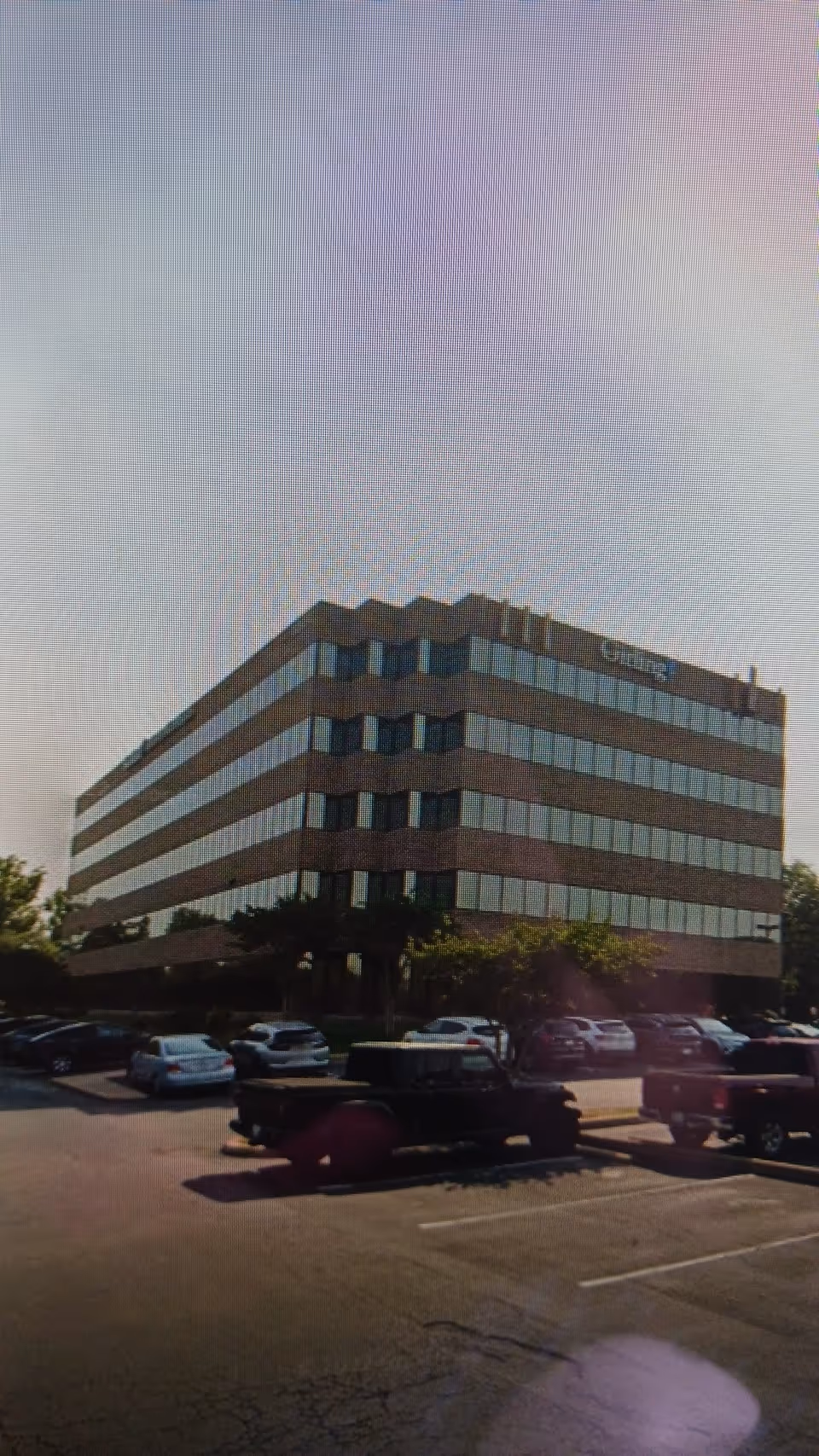 Exterior view of a CenterWell Home Health building with a parking lot in front.