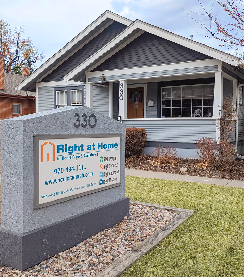 Front view of a Right at Home senior care facility with a sign and entrance.