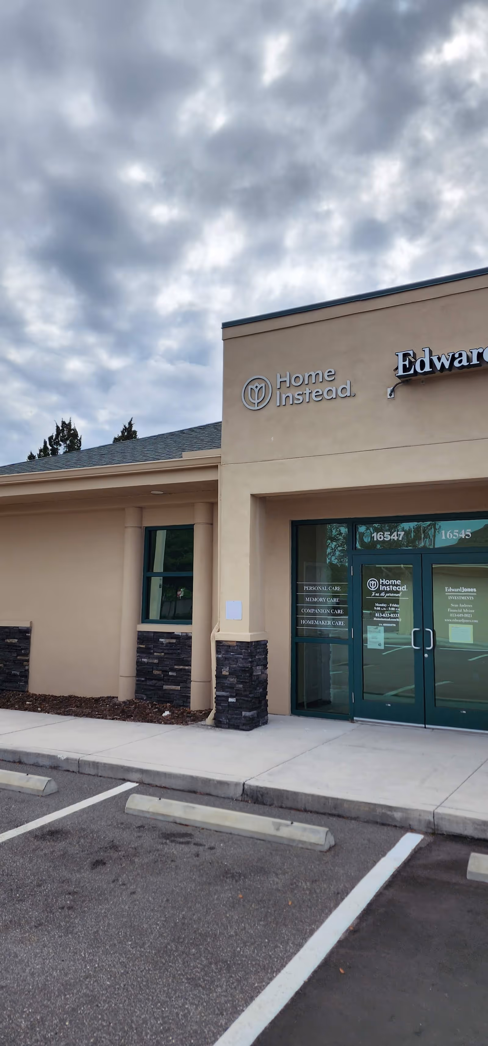 Exterior view of a Home Instead senior care facility with entrance doors.