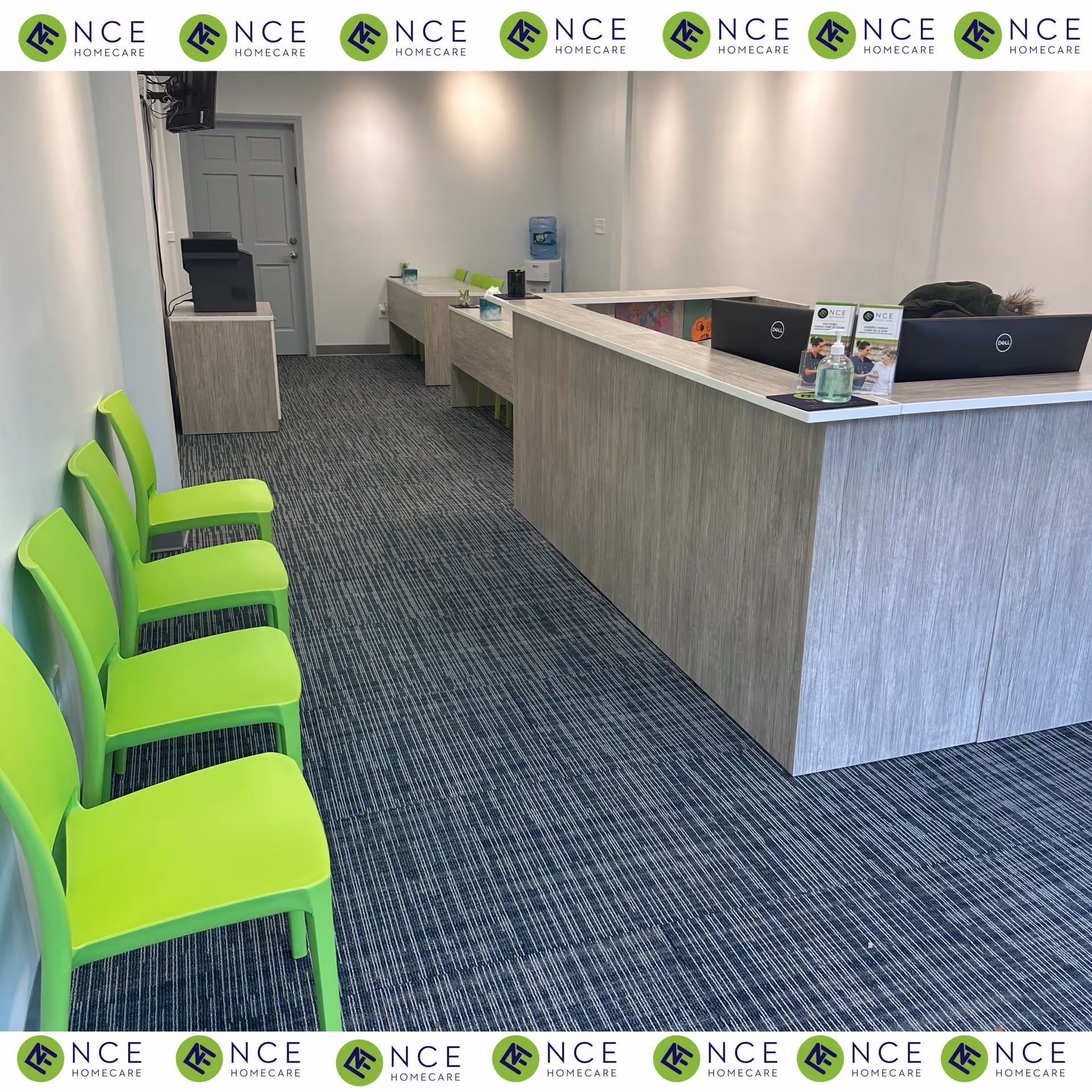Interior reception area with a long light wood counter and lime green chairs.