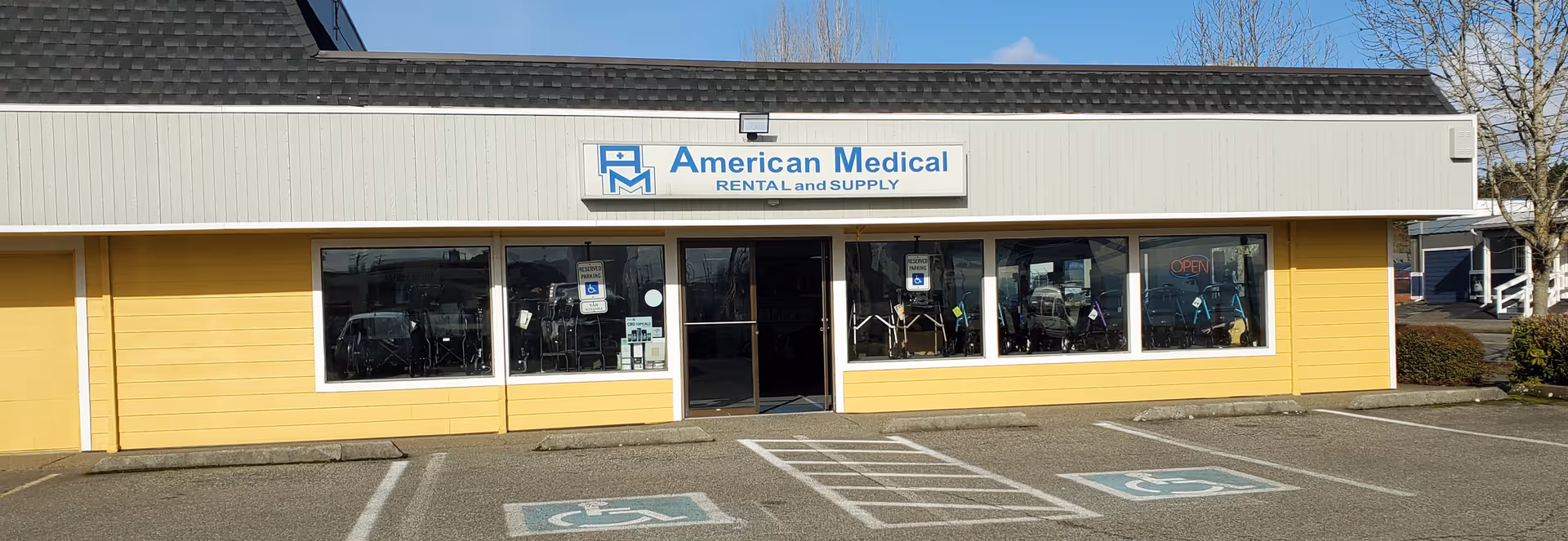 Single-story yellow storefront with a white sign reading American Medical Rental and Supply.