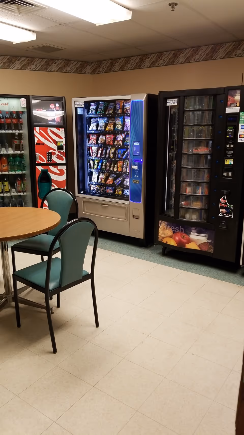 Indoor break area at Wayne Memorial Hospital with vending machines and seating.
