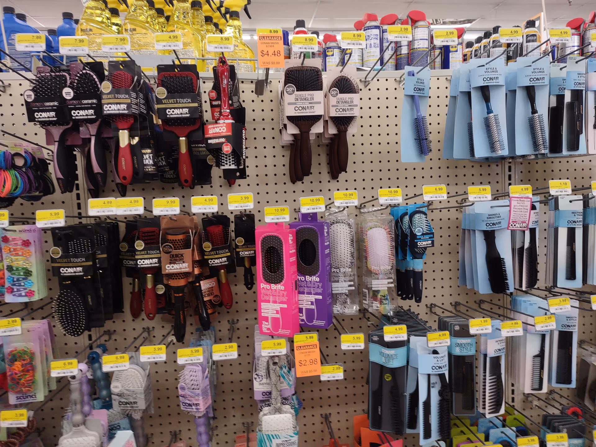 Discount Drug Mart aisle displays hair brushes, combs, and grooming tools.