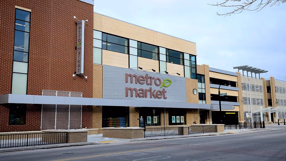 Exterior view of a Metro Market storefront with brick and glass façade.