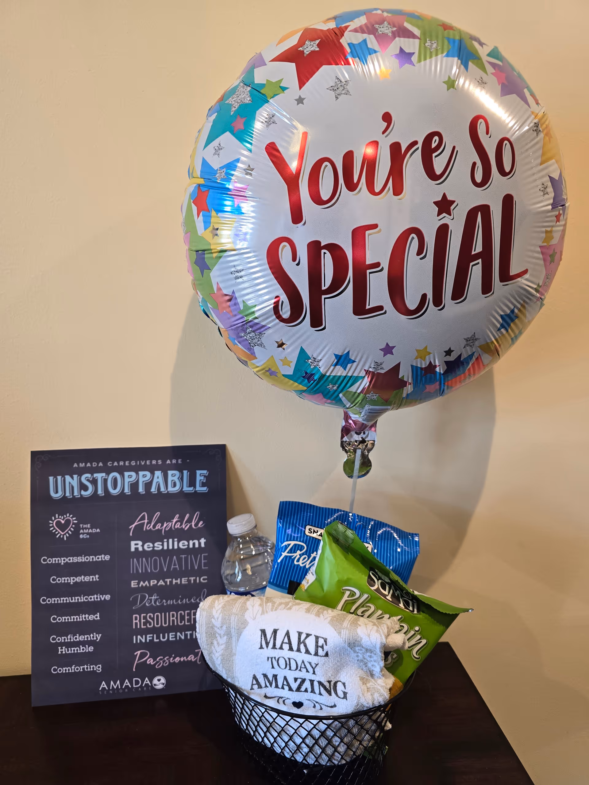 Colorful balloon reads You're So SPECIAL beside an inspirational chalkboard and snack basket.