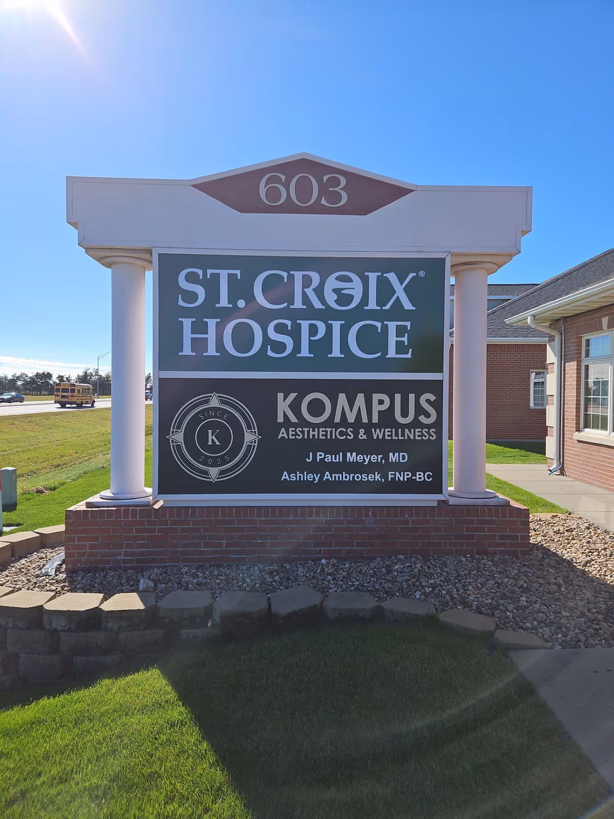 Front exterior sign for St. Croix Hospice with Kompus Aesthetics & Wellness branding.
