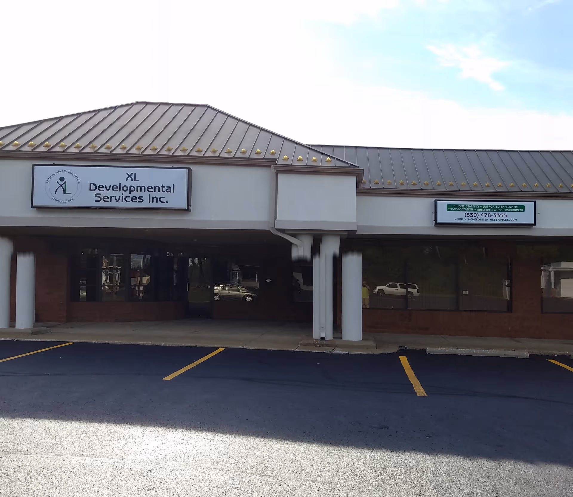 Exterior view of XL Developmental Services Inc. building with sign