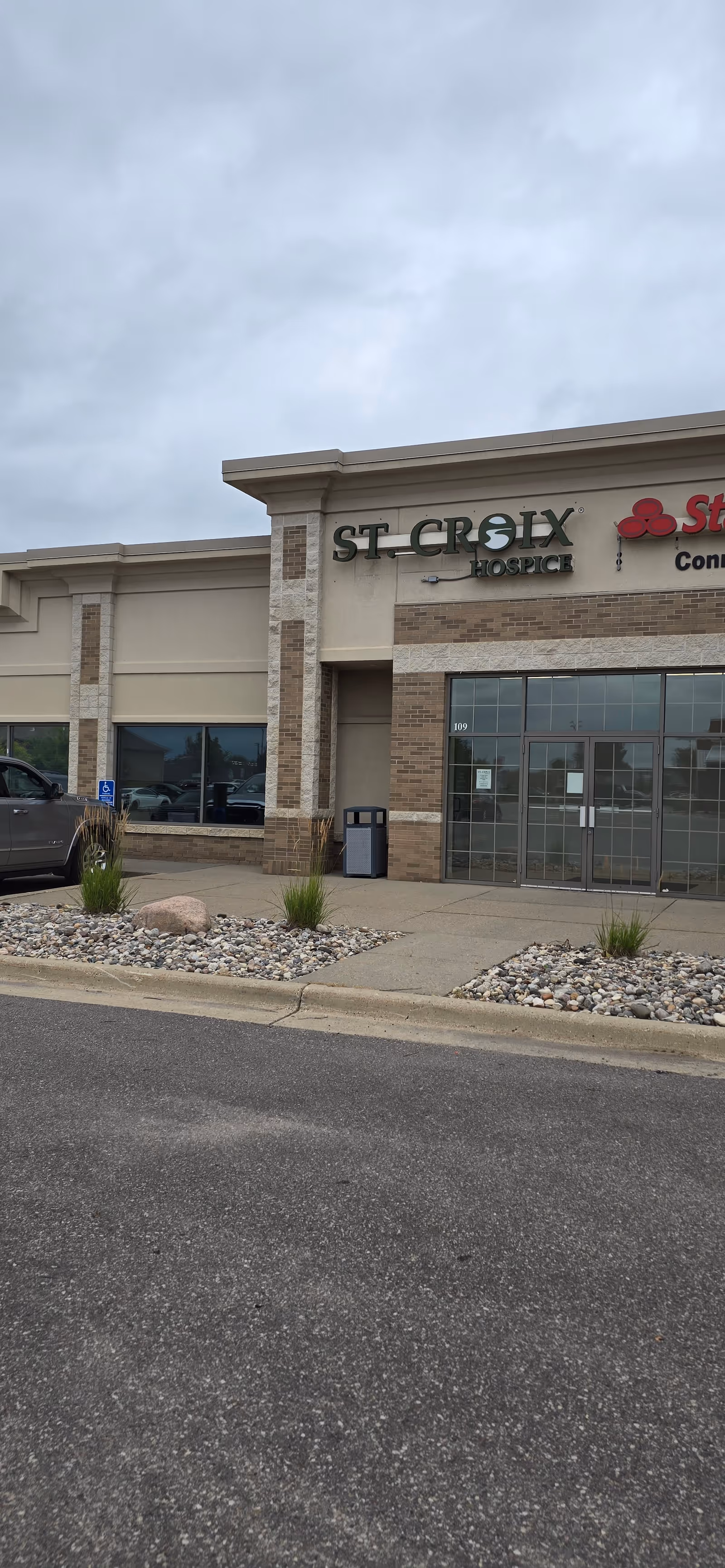 Exterior view of St. Croix Hospice building entrance with signage.