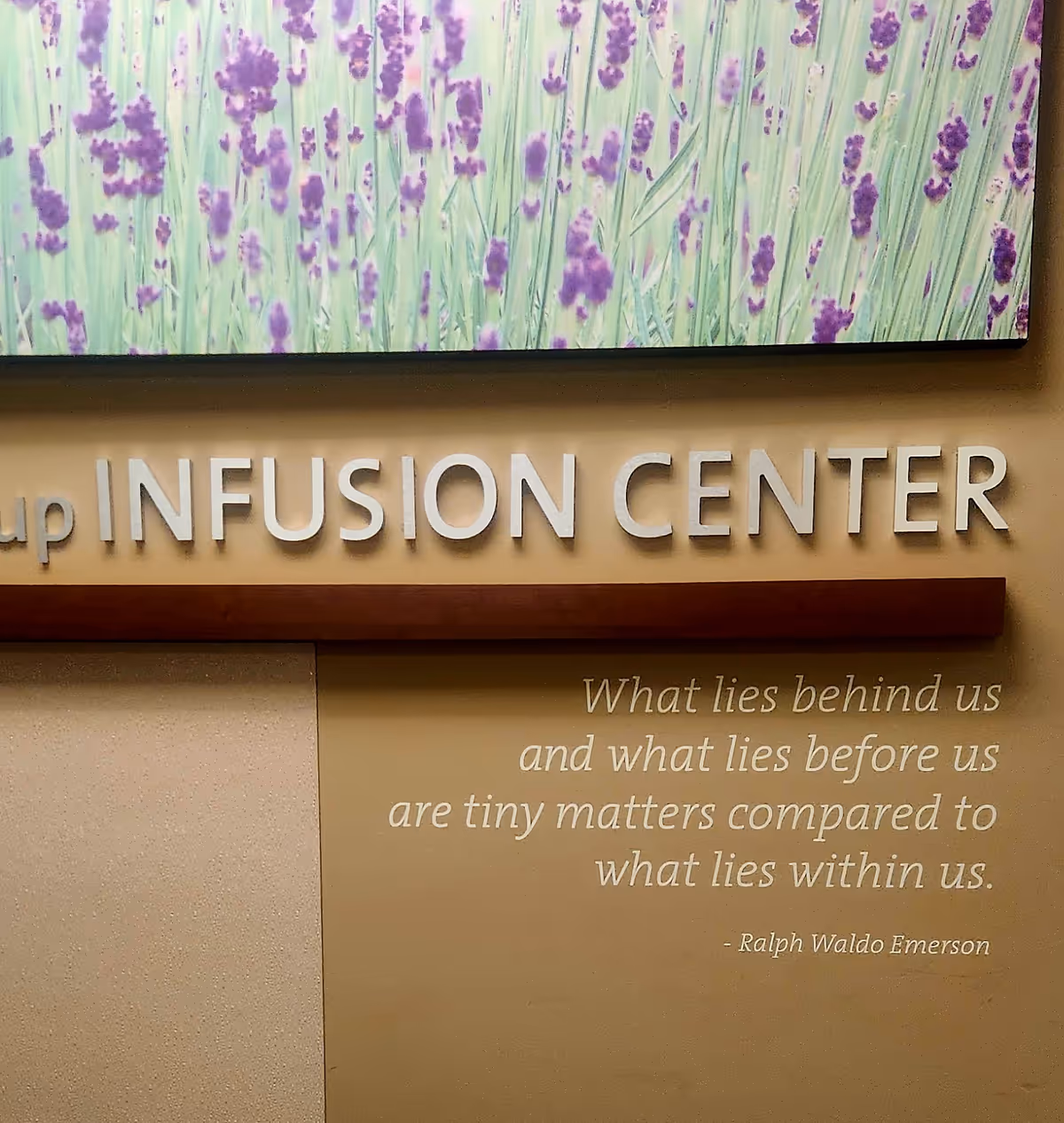 Interior wall with lavender artwork and Infusion Center signage.