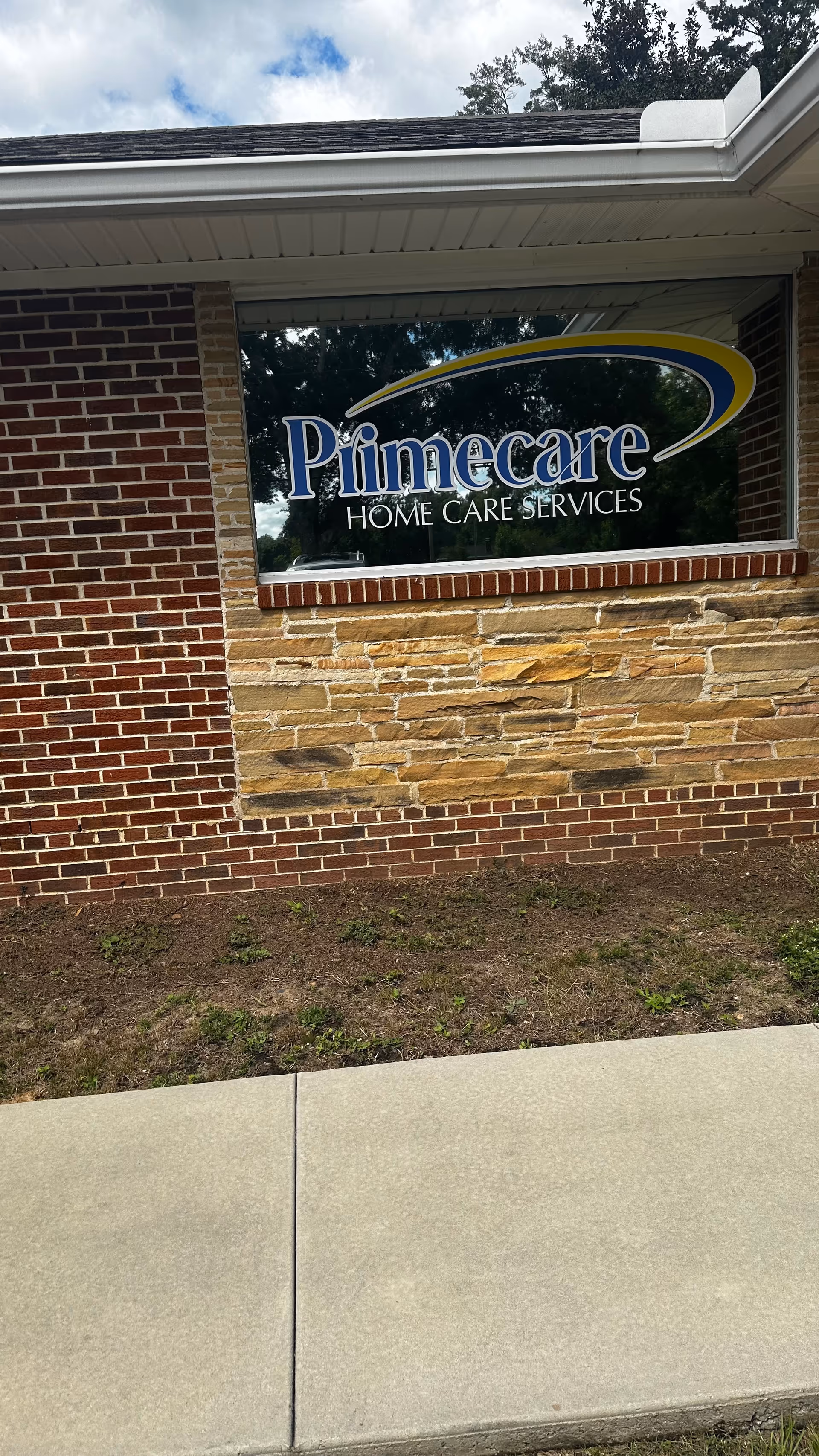 Exterior of Primecare Home Care Services building with brick facade and sign