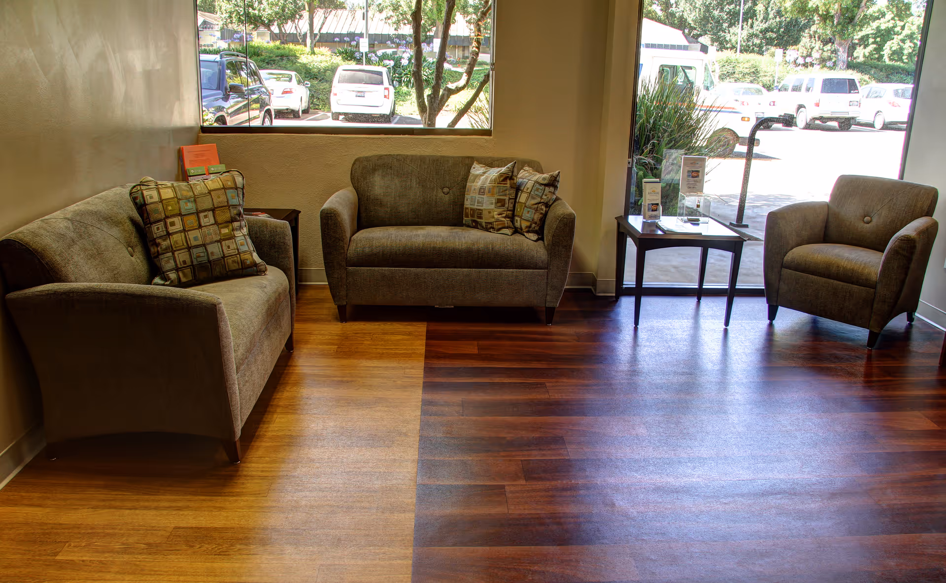 Interior lounge at Hinds Hospice with sofas, chairs, and a window view.