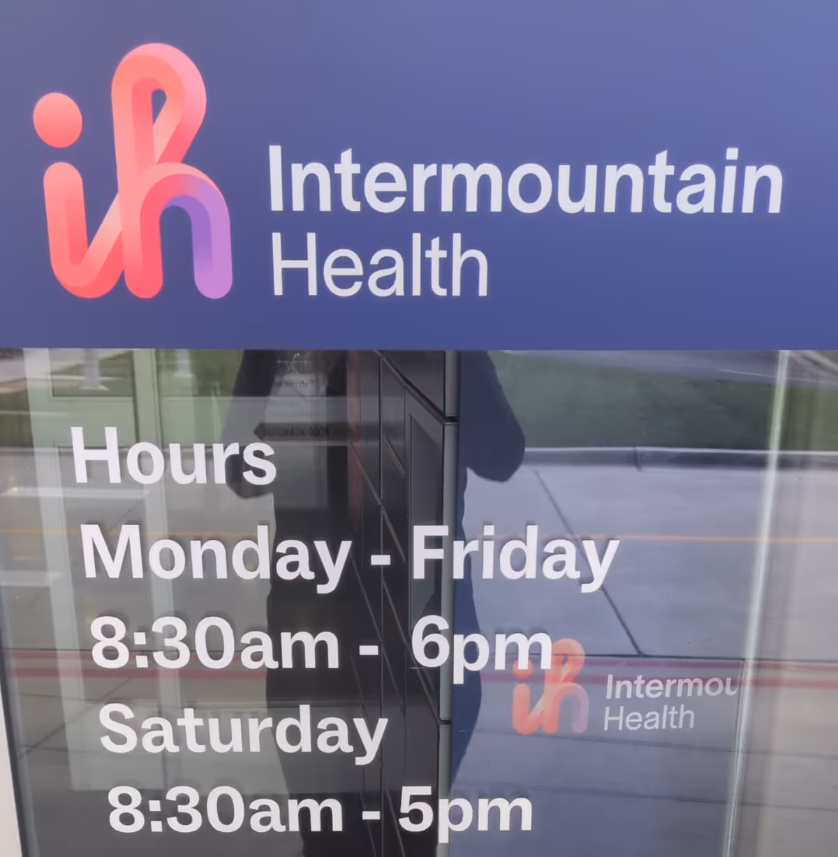 Front entrance with Intermountain Health sign and hours on glass doors.