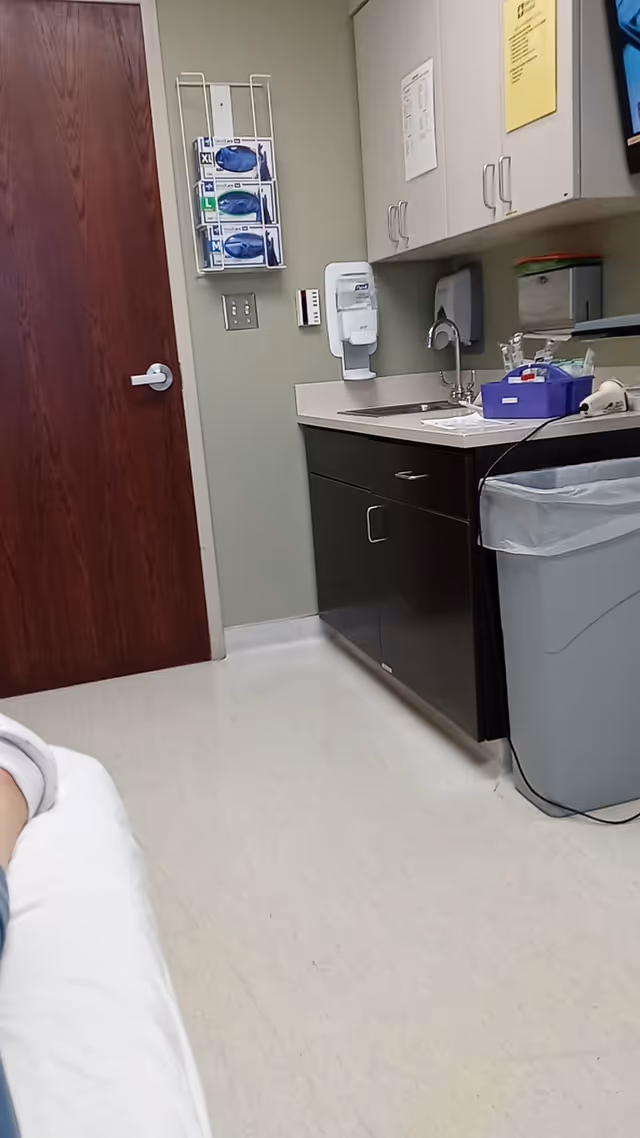 Interior medical kitchenette in Saint John Hospital corridor with sink and cabinets.