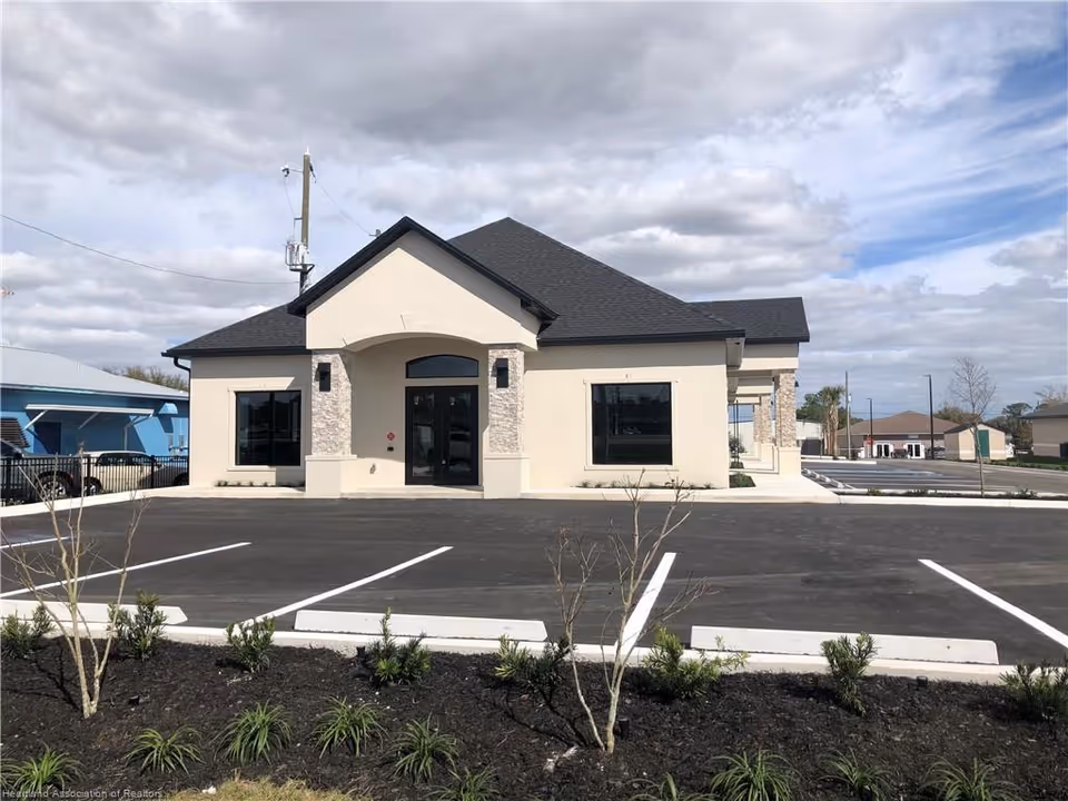 Beige Comfort Keepers building with arched entrance and surrounding parking lot
