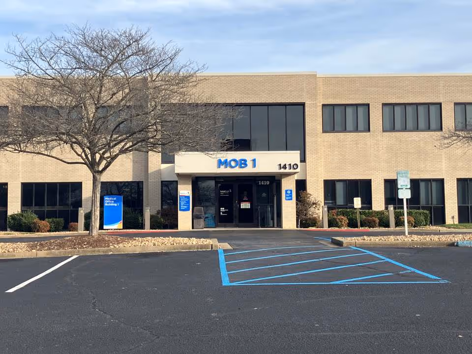 Exterior view of a medical office building with MOB 1 signage and parking.