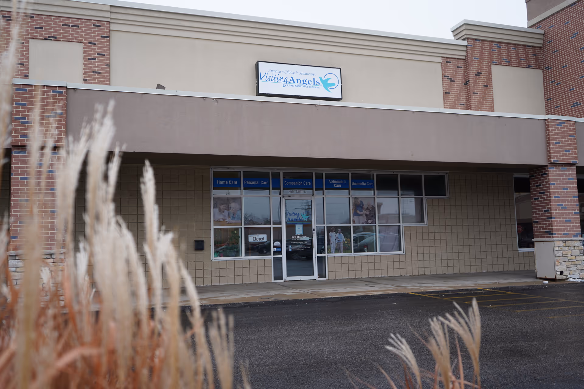 Exterior view of Visiting Angels Oshkosh senior home care storefront with entry doors