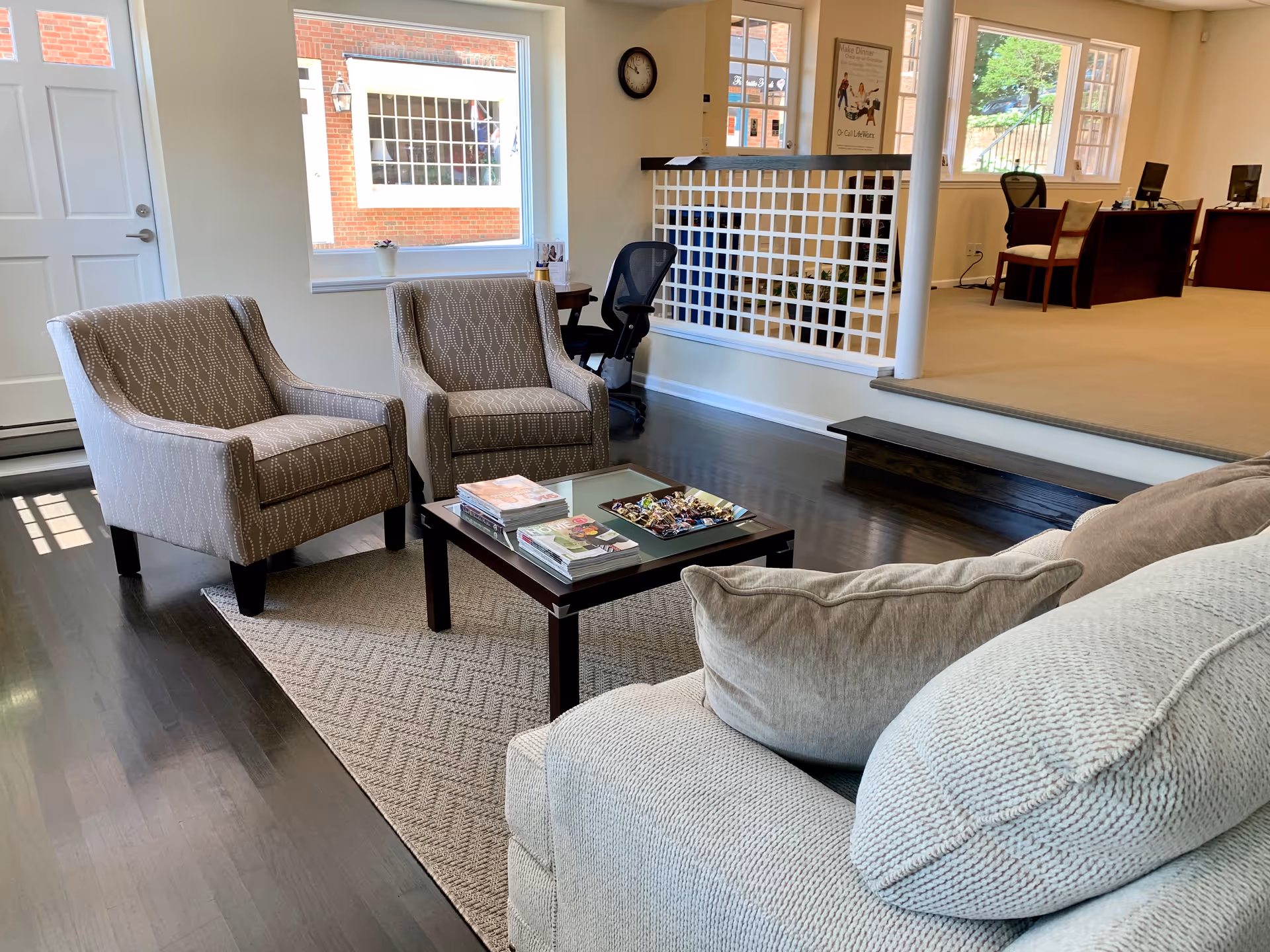 Cozy seating area in a senior living facility lounge with two armchairs and a coffee table.
