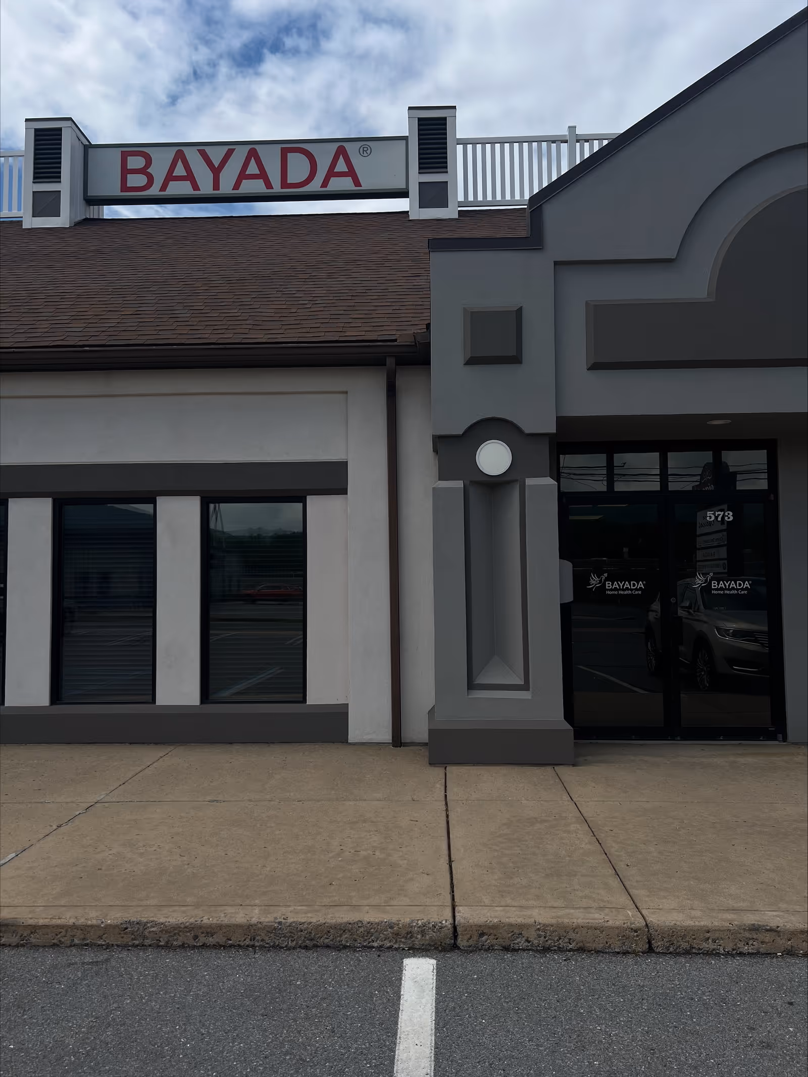 Exterior view of a BAYADA Assistive Care building with a prominent BAYADA sign.