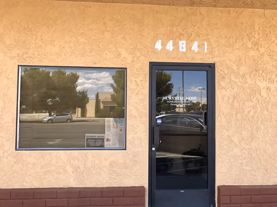 Front facade of Crystal Rose Home Health Care, featuring a glass door and large window.