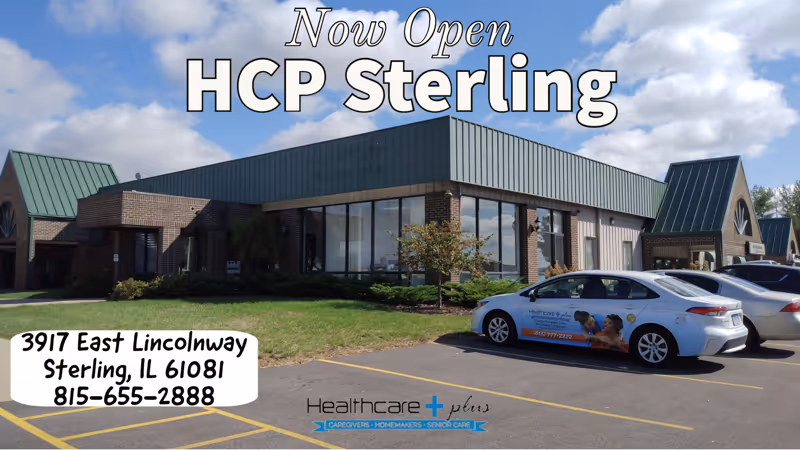 Exterior view of Healthcare Plus Sterling building with Now Open sign and parked cars.