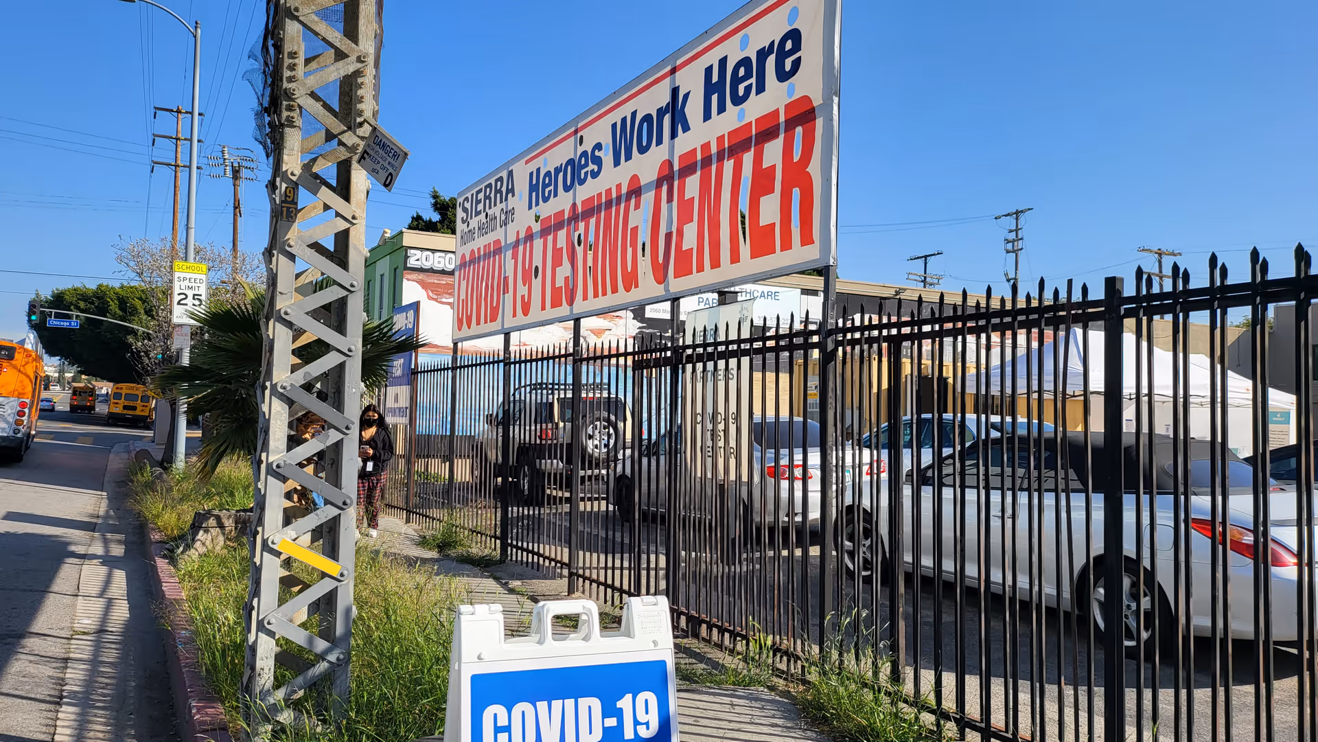 Exterior view of Sierra Healthcare Partners site with a large COVID-19 testing center banner.