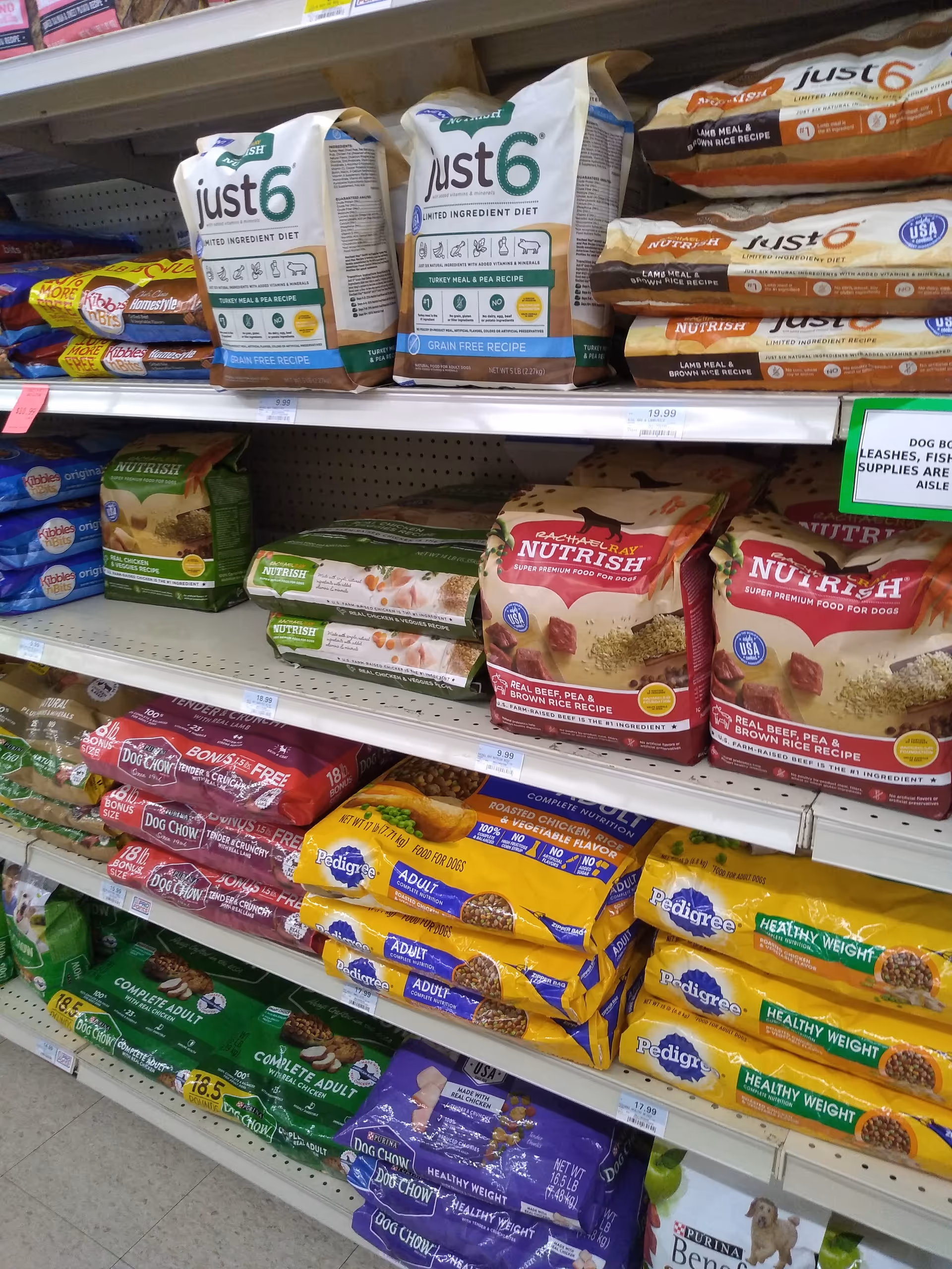 Discount Drug Mart interior with shelves stocked full of pet food bags.