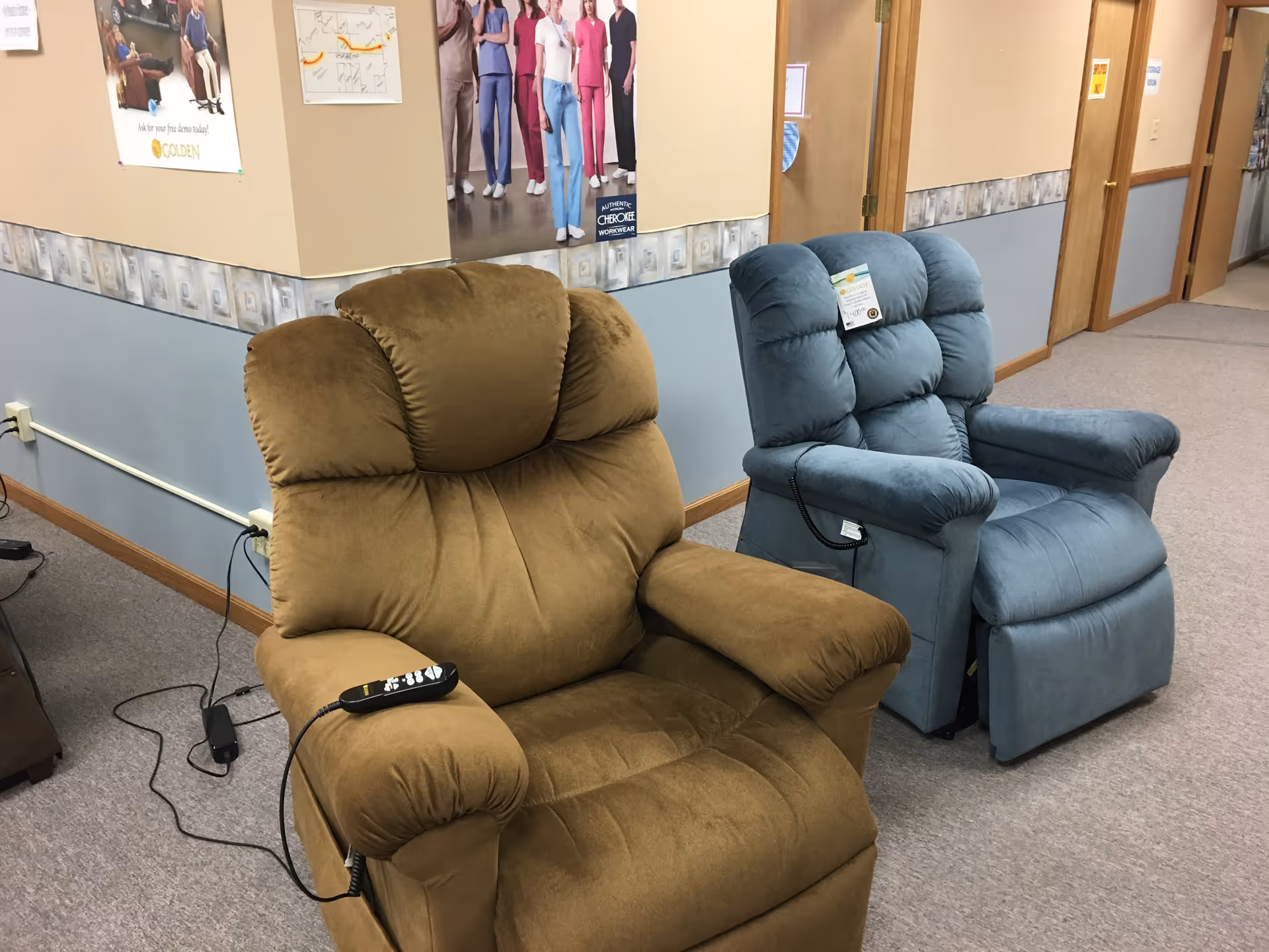 Two recliner chairs in a hallway lounge of a senior facility.